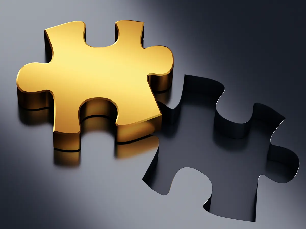 Golden puzzle piece beside its empty slot, symbolising design