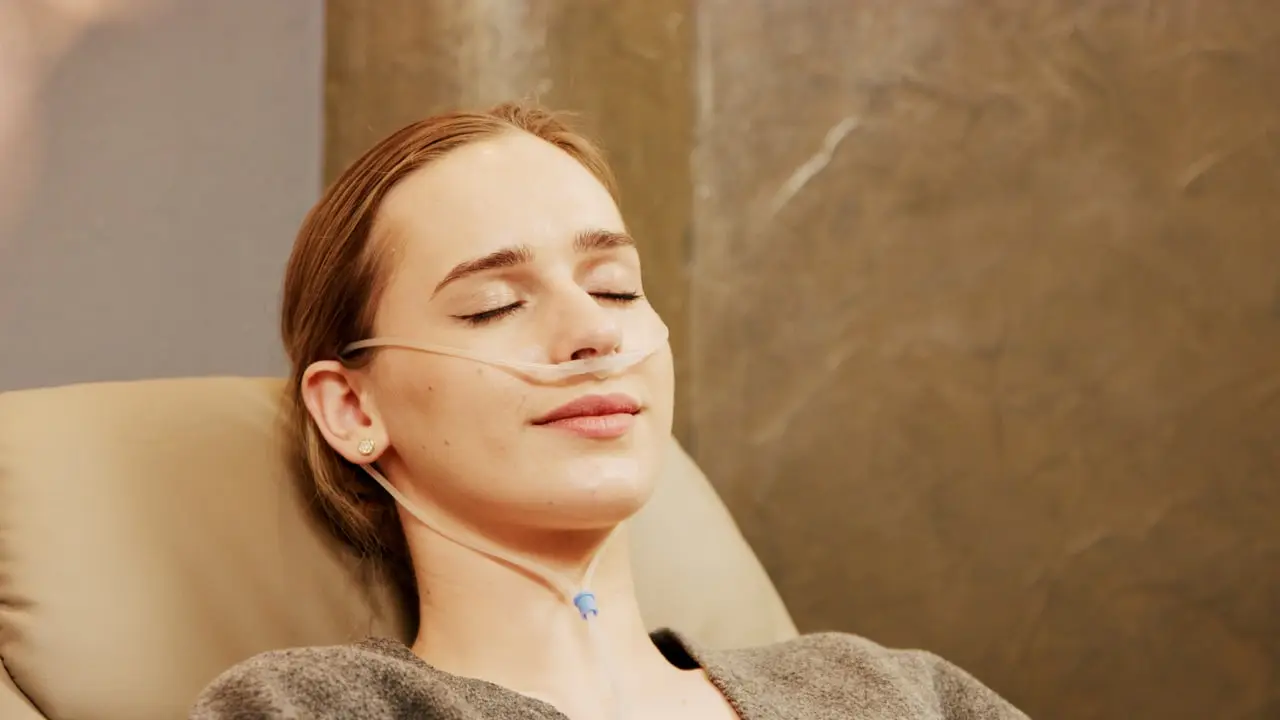 Woman relaxing during a hydrogen inhalation with a nasal cannula